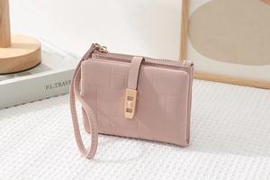 Close-up of pink PU leather wallet featuring quilted pattern and gold-tone hardware detail