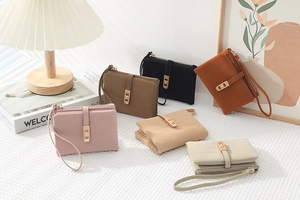Detailed flat lay of quilted PU leather wallets in various colors with wrist straps
