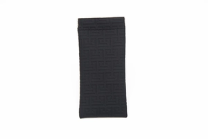 Detail of black textured eyeglasses pouch with Greek Key pattern and spring closure