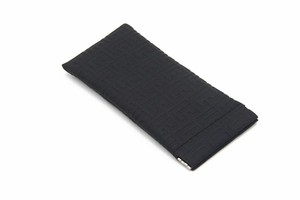 Detailed view of black textured glasses pouch with automatic metal spring closure
