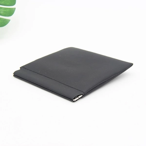 Close-up of matte black vertical glasses case with automatic metal snap closure detail
