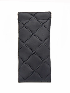 Detail of black quilted leather glasses pouch with metal squeeze spring closure