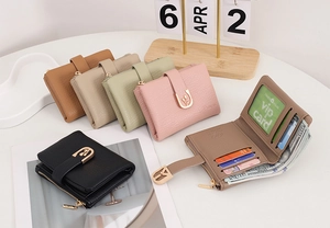 Detailed view of women's leather wallet with tulip buckle showing card slots and coin pocket