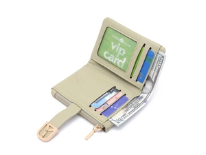 Interior detail of a trifold light green PU leather wallet showing card slots and compartments