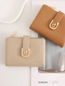 Detail of PU leather wallet showing gold U-shaped floral buckle and side zipper closure