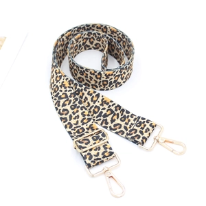 Detail of leopard print wide strap with gold-tone swivel hooks and adjustable buckle