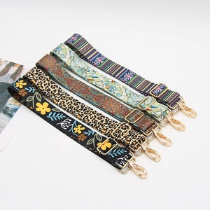 Selection of wide patterned shoulder straps with gold hardware and various stylish prints