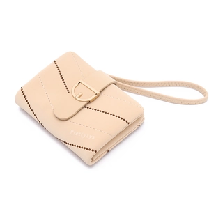 Close-up of beige quilted short wallet with gold buckle and diagonal stitching detail