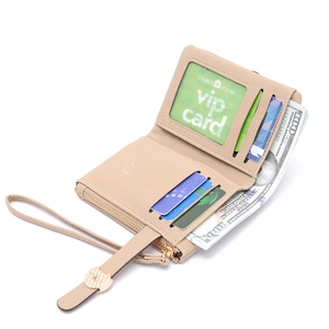 Interior detail of a beige folding wallet showing card slots and a clear ID window
