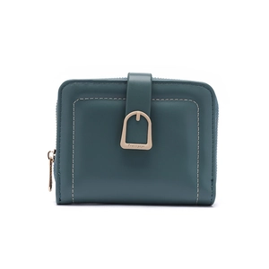 Detail of teal faux leather wallet featuring a decorative metal clasp and side zipper