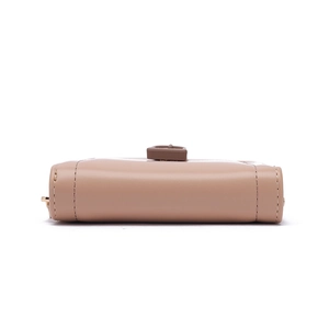 Close-up of minimalist beige PU leather wallet base showing precise stitching details