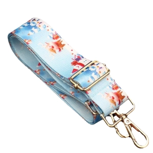 Adjustable wide shoulder strap with light blue Christmas reindeer print and gold hardware