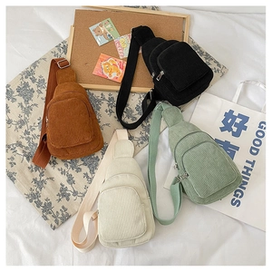 Corduroy crossbody fanny packs in four colors featuring ribbed fabric and adjustable strap