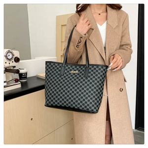 Retro black tote bag with M-letter print and gold logo for autumn winter 2024
