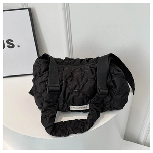 Black quilted puffer shoulder bag with stylish pleats and adjustable wide straps