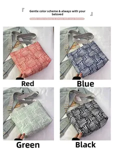 Canvas tote bags shown in red, blue, green, and black with polka dot wide straps