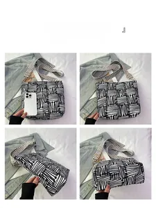 Detail views of canvas tote bag with black and white abstract geometric pattern
