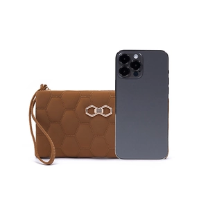 Detailed view of brown quilted clutch wallet with gold bow and size comparison to smartphone