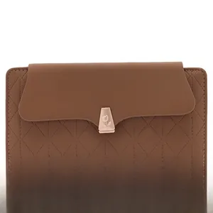 Detail of coffee brown quilted PU leather wallet with golden tulip flower metal clasp