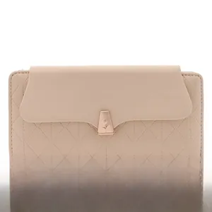 Close-up of beige quilted PU leather wallet with elegant tulip metal buckle and wavy edge