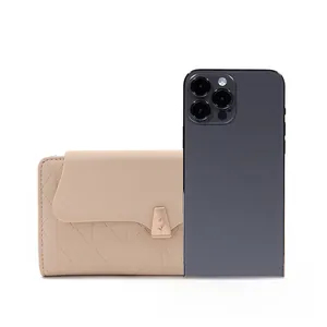 Quilted beige long wallet with gold tulip charm next to a phone for size reference