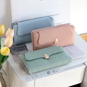 Three long PU leather wallets with quilted stitching and gold flower metal clasps
