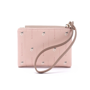 Detailed view of pink floral PU leather wallet with zipper and wristlet strap