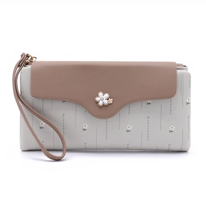 Detail of floral long wallet with leather wristlet strap and white flower button