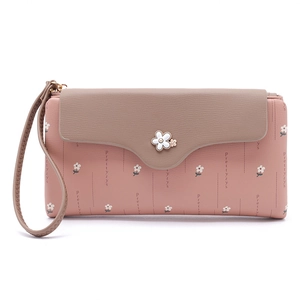 Detail of pink long wallet with daisy floral print and floral metal buckle closure