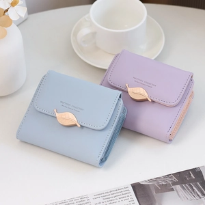Close-up of PU leather short wallets with leaf buckles in light blue and purple