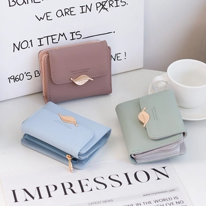 Detailed view of PU leather wallets with leaf buckles in pink, blue and green colors