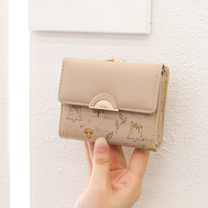 Close-up of beige PU leather wallet with printed forest mushrooms and maple leaves