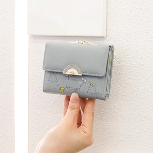 Detailed view of women's short PU leather wallet with mushroom print and gold kiss-lock