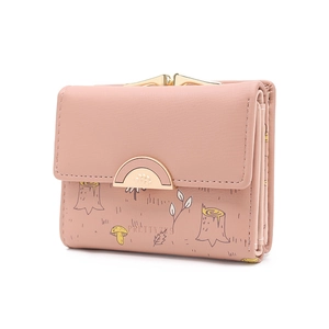 Detail of light pink floral wallet featuring mushroom prints and a gold metal buckle clasp