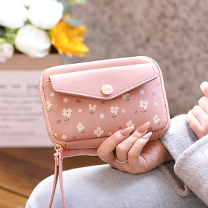 Detail of floral passport wallet with zip closure and matching wrist strap