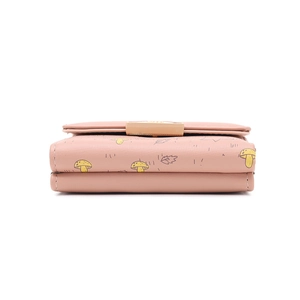Side view detail of tri-fold pink wallet with mushroom pattern and neat stitching