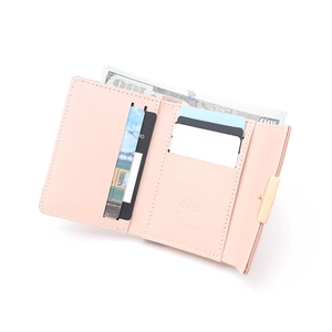 Detail view of pink trifold wallet interior with multiple card slots and cash compartment