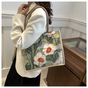 Linen tote bag with 3D floral embroidery and woven handles for casual commute