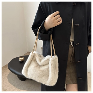 Fuzzy faux fur tote bag in creamy white with slim straps for autumn shoulder carry