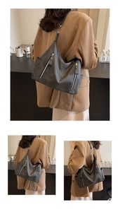 Détail du grand sac cabas gris foncé avec fermetures éclair et texture mate douce