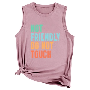 Macro detail of the dusty rose vest featuring artistic NOT FRIENDLY DO NOT TOUCH text