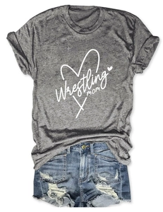 Flat lay of grey Wrestling Mom T-shirt with heart graphic and ripped denim shorts