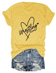 Detail of Wrestling Mom graphic on yellow t-shirt paired with distressed denim shorts