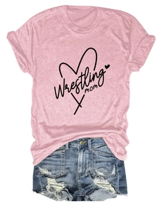 Pink Wrestling Mom t-shirt paired with distressed blue denim shorts on white background