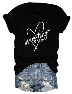 Detailed flat lay of black Wrestling Mom T-shirt paired with distressed blue denim shorts