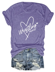 Flat lay of heather purple wrestling mom t-shirt with heart graphic and ripped denim shorts