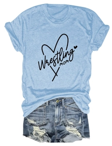 Flat lay of light blue Wrestling Mom T-shirt paired with distressed denim shorts