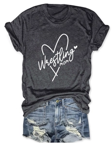 Flat lay of charcoal wrestling mom t-shirt paired with frayed denim shorts