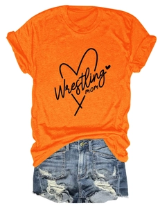 Detail of wrestling mom print on orange t-shirt and distressed blue denim shorts set