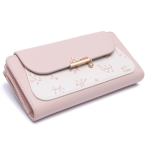 Detail of pink floral PU leather wallet featuring a stylish metal clasp with branding